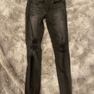 Distressed stretch skinny jeans